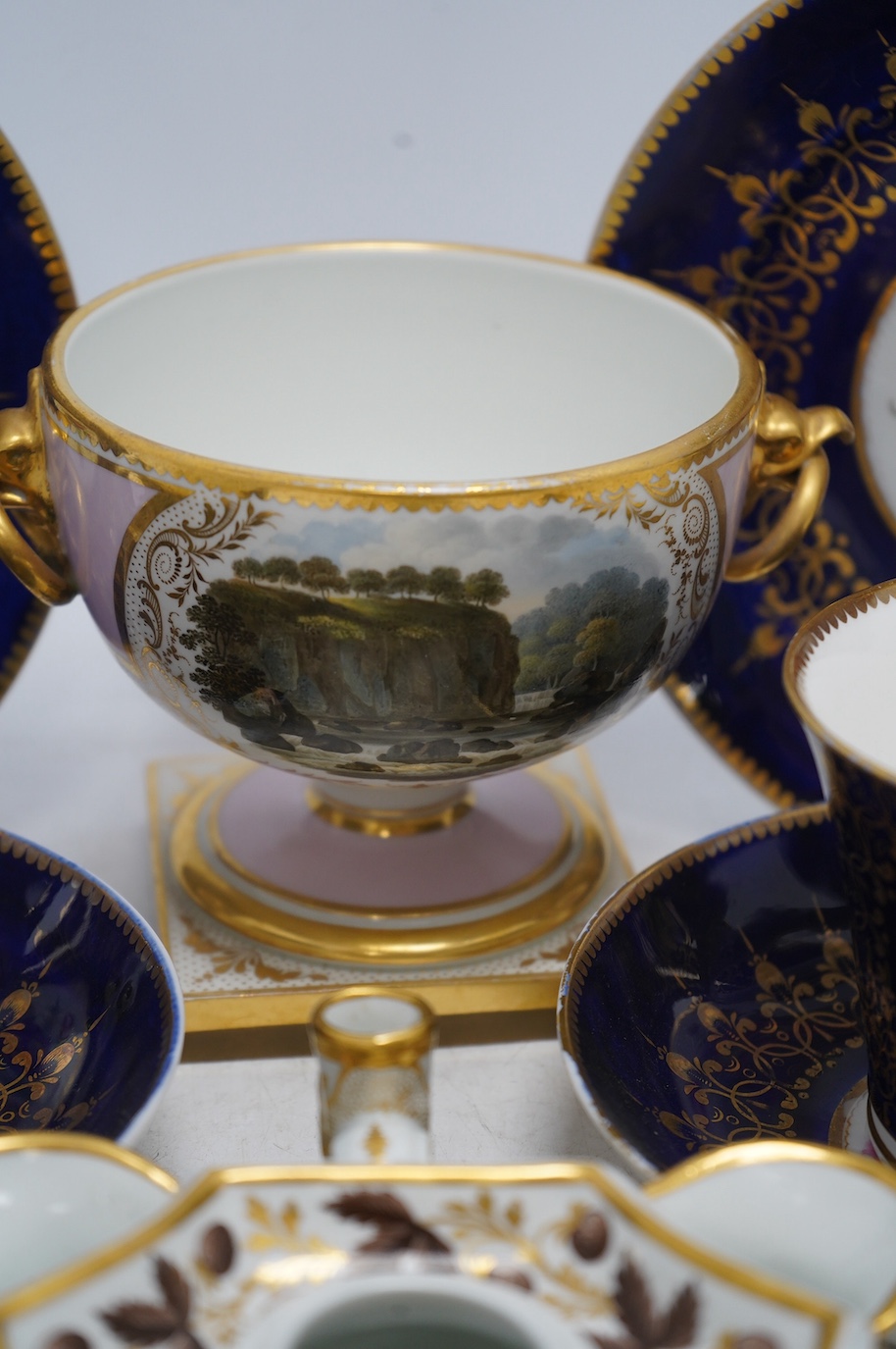 A quantity of 19th century porcelain to include Flight Barr & Barr, Worcester pedestal bowl, two Chamberlains Worcester breakfast trios and ink stand, largest 11cm high. Condition - fair, Flight Barr & Barr restored